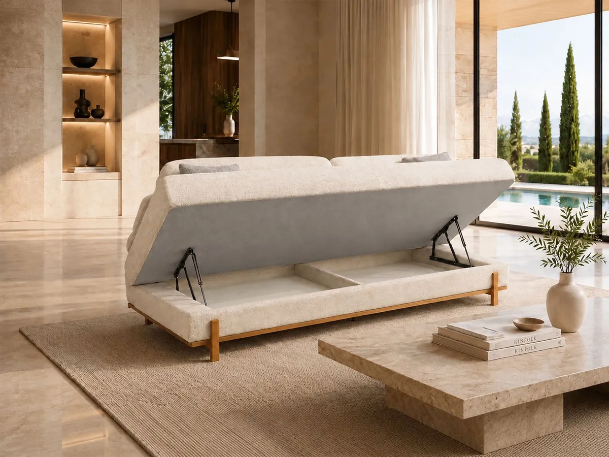 Close view of the SIMENA sofa showing deep button tufting, curved arm detail and soft green fabric.